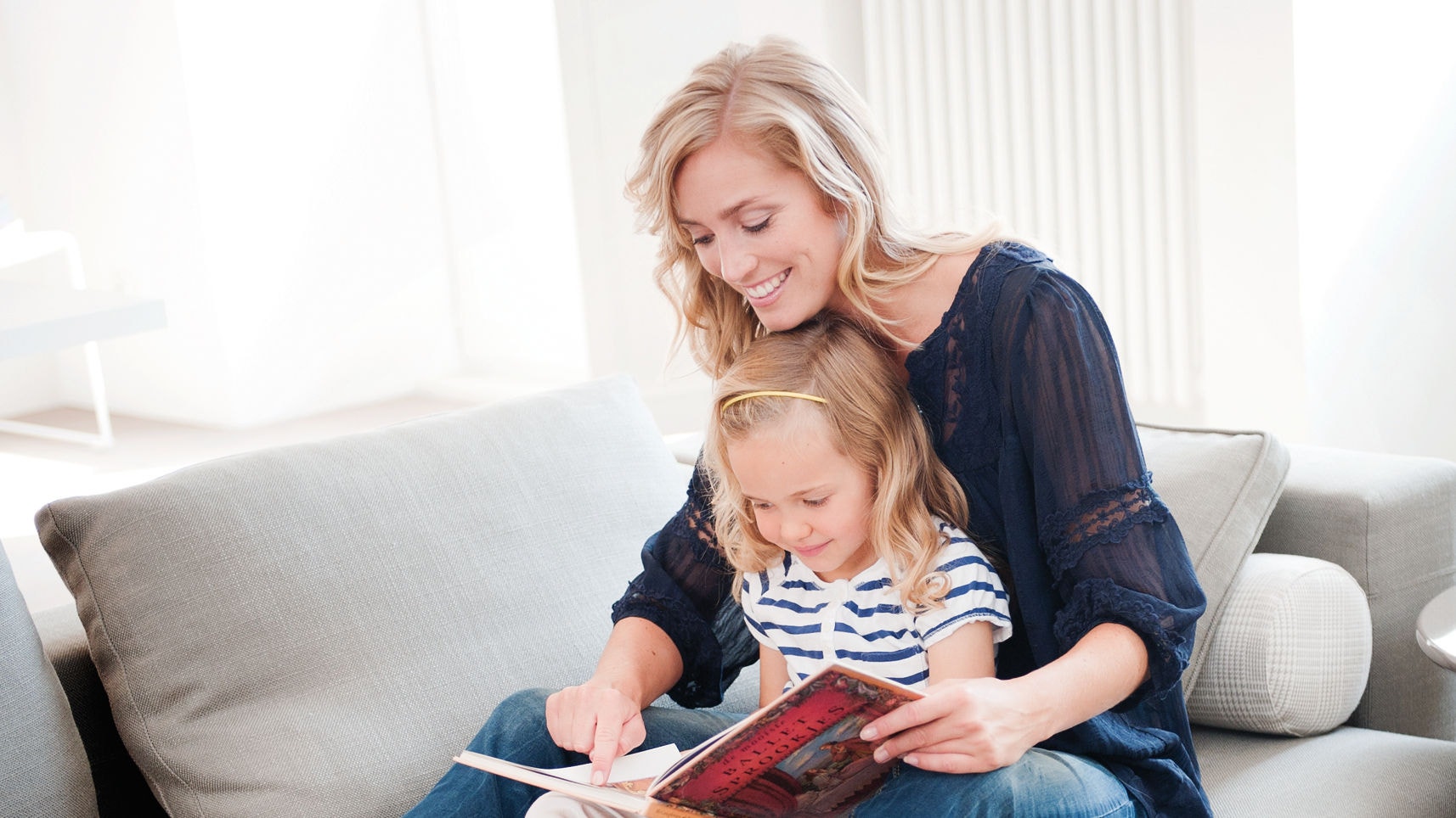 Mother and daughter reading a book